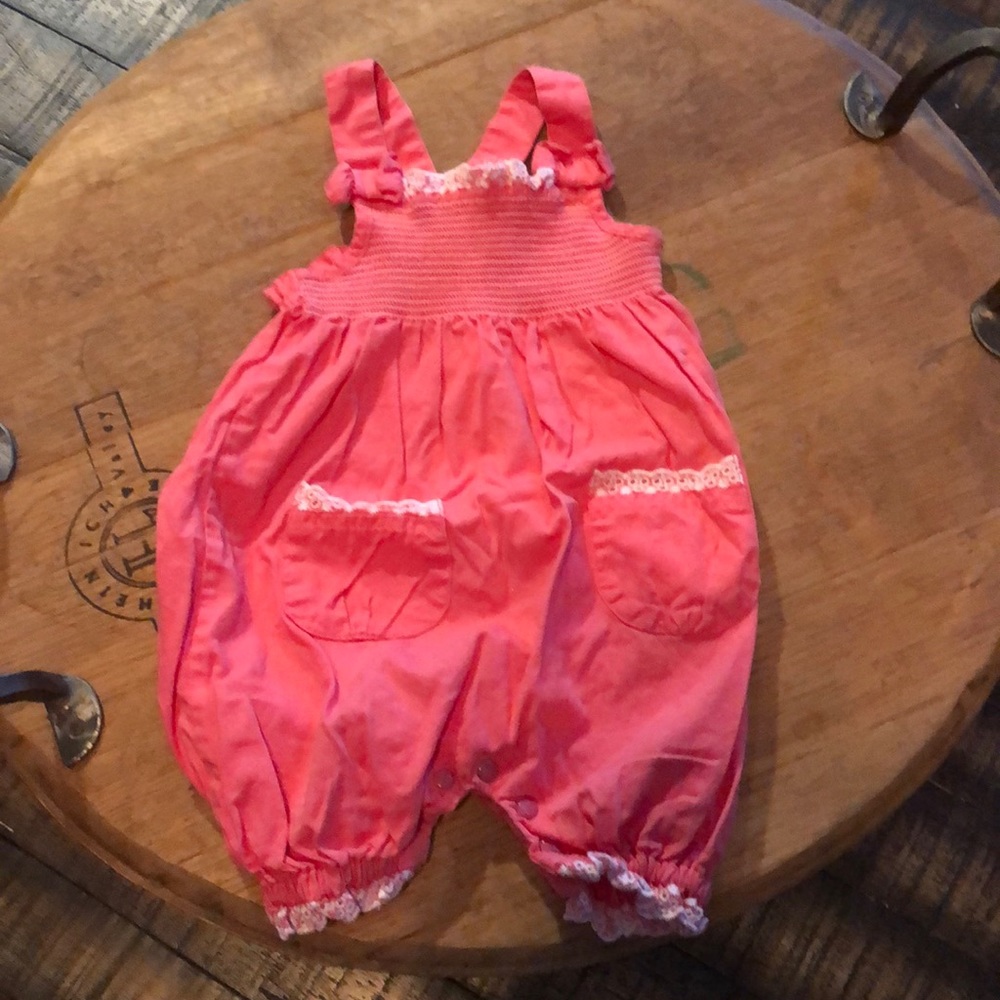 Adorable little girls pink romper